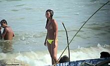 Topless hoe shows her breasts at a nudist beach